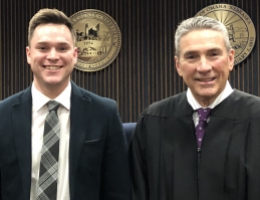 Photo: Problem-Solving Court Judge Tom Otepka (right) with December graduate.