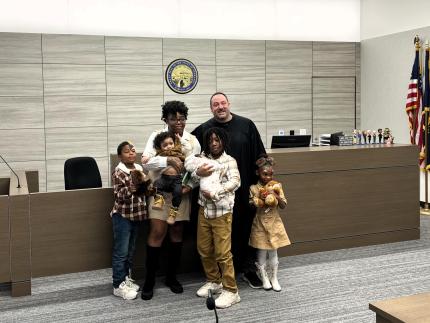 Judge Chad Brown with newly-created family of five