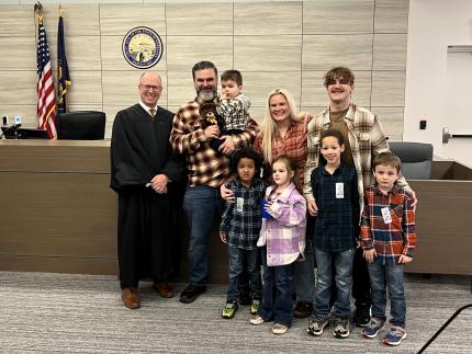 Judge Matthew Kahler with family following adoption proceedings