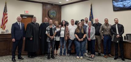 Photo: Justice Jason Bergevin, Judge Patrick Lee, Judge John Marsh, Supervision Officers Amy Norton, Ralyn Tennant, and Isaac Obermiller, Coordinator Susan Huber, graduates Josh, Margaret, Jason, Alexis, Isaiah, Hugo, and Jacob.
