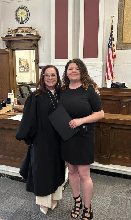 Photo: Judge Shelly Stratman with graduate Mia.