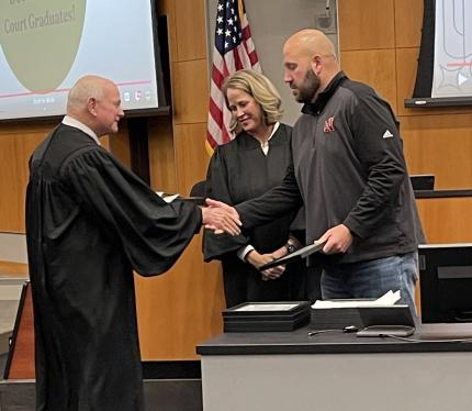 Judge John A. Colborn with graduate