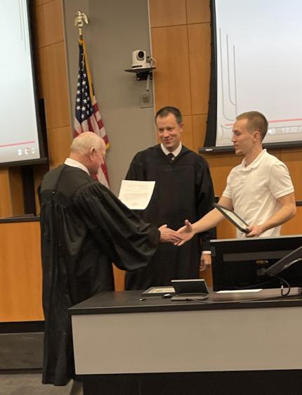 Judge John A. Colborn with graduate