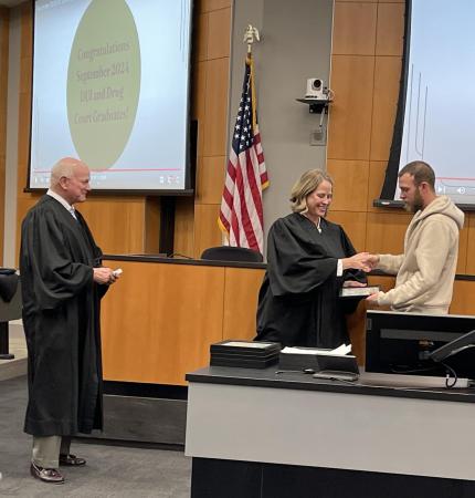 Judge John A. Colborn with graduate