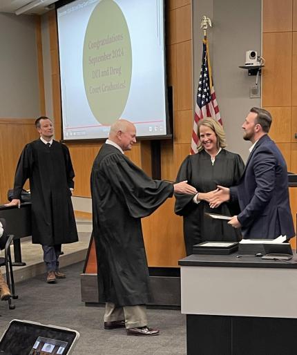 Judge John A. Colborn with graduate