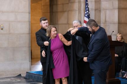 Judge Freeman putting robe on