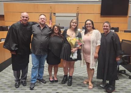 Photo: Retired Judge Robert Wester, graduates Dave, Crystal, Lydia, Caprice, and Judge Stefanie Martinez.