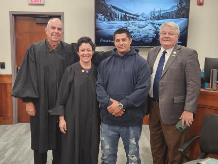 Photo (L to R): Judge Robert Wester, Judge Stefanie Martinez, graduate Vince, and Senator Rick Holdcroft.