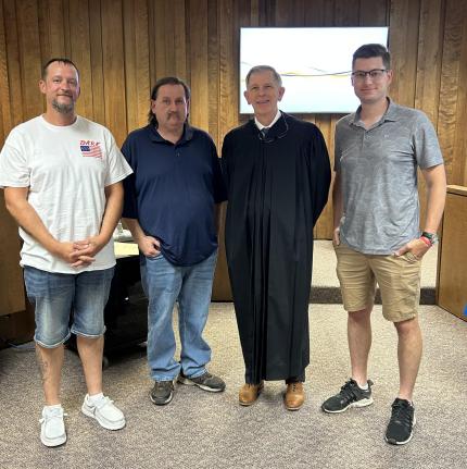 Photo (L to R): Graduates Charles, Larry, Judge James Stecker, and Larry.