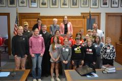 Photo: Judge Richard Smith invites Pawnee City students to the front of the courtroom for a commemorative Law Day photo.